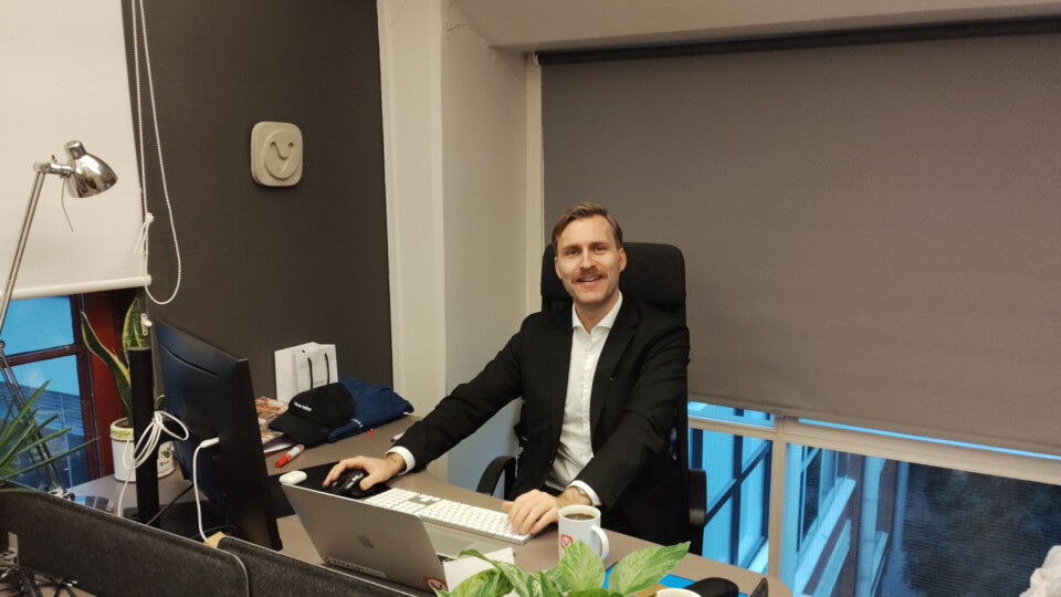 Haakon Rølmann looking dapper at his desk