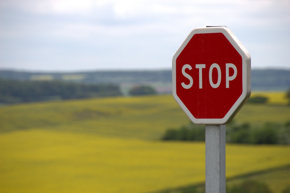 Stop sign in front of a field telling Microsoft to stop stealing the browser
