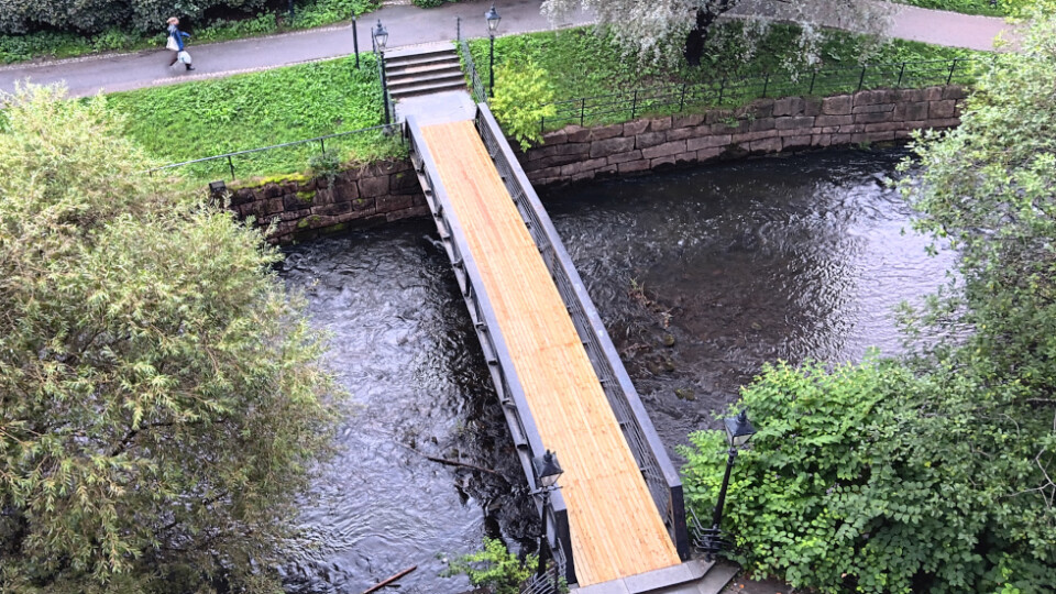 A bridrge with a bright new wood walkway