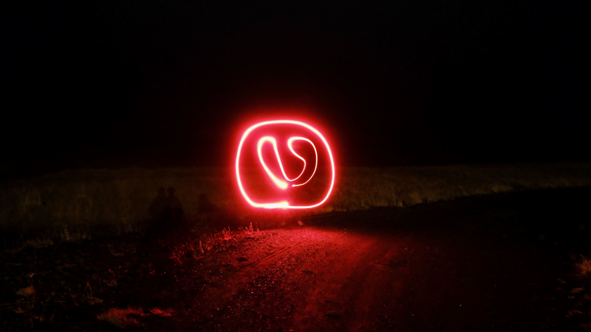 A hand drawn vivaldi logo done via log exposure at night