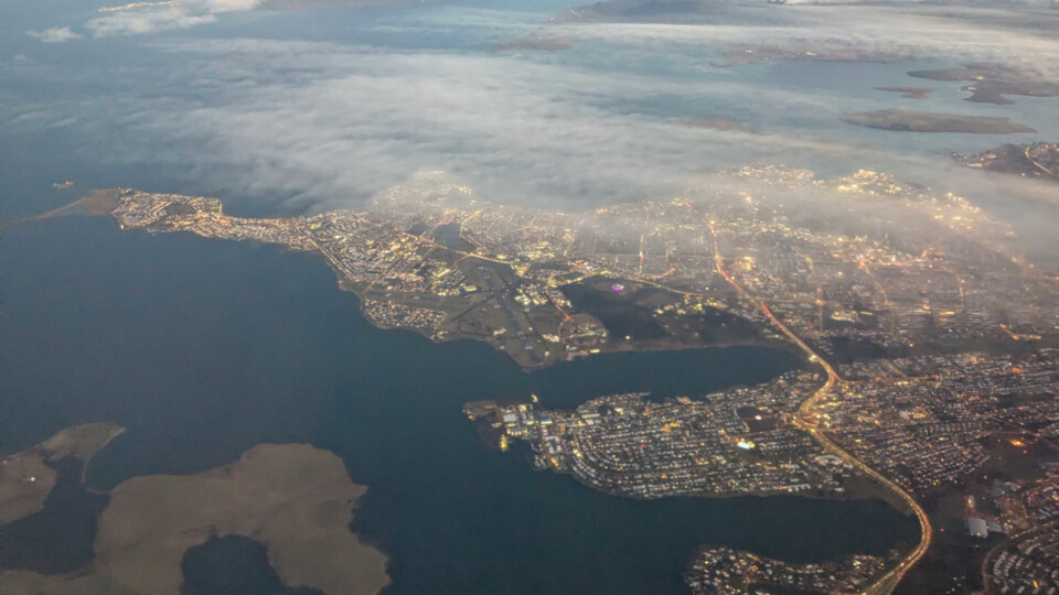 Looking back at Iceland from the window or a plane that just left Keflavík.