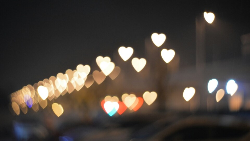 Hearts light up on a dark background