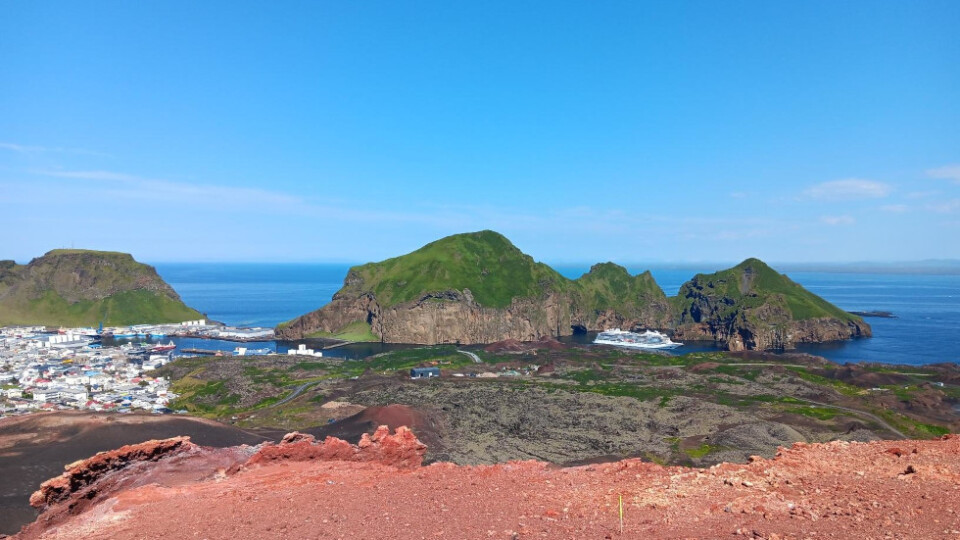 View from on the top of Eldfell volcanic cone on Vestmannaeyjar looking down at Heimaey