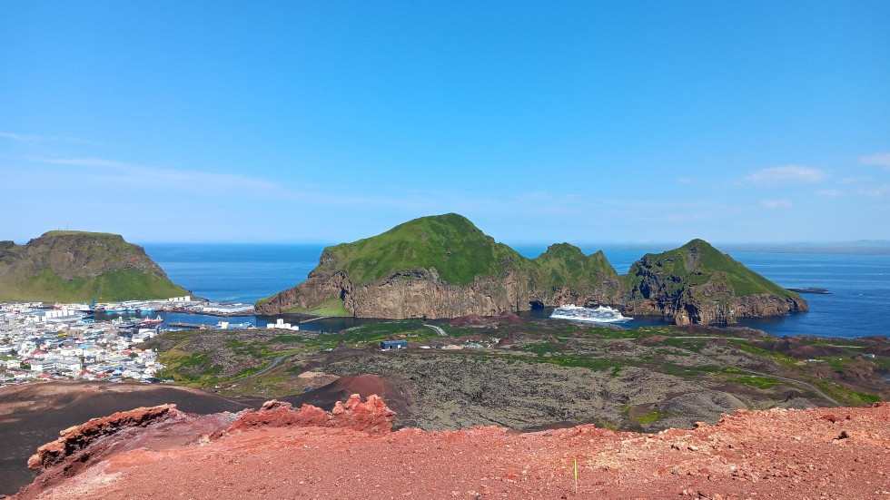 View from on the top of Eldfell volcanic cone on Vestmannaeyjar looking down at Heimaey