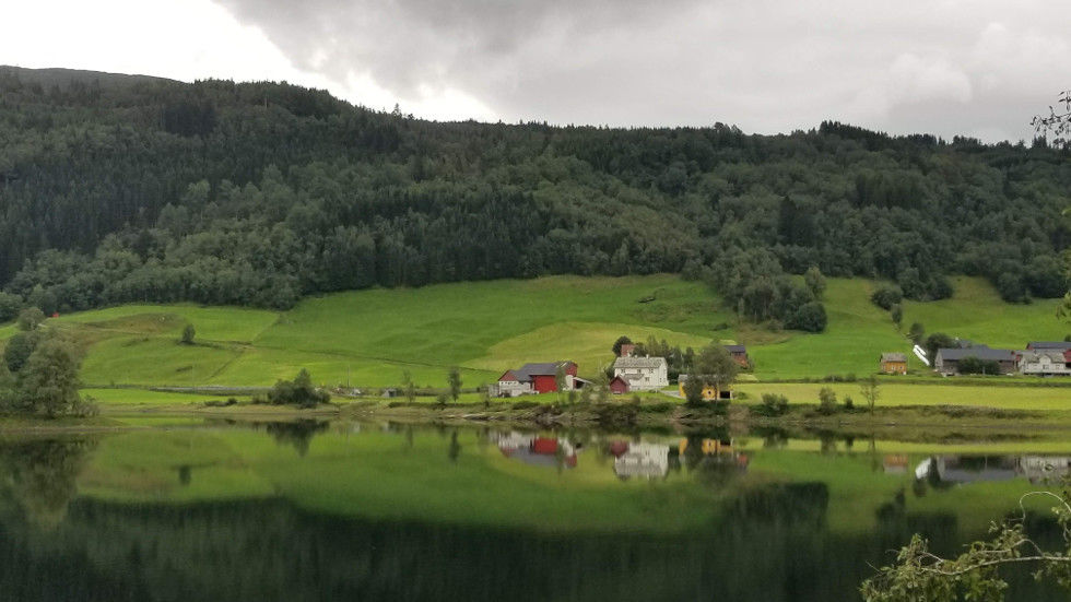 Norwegian farm by a river
