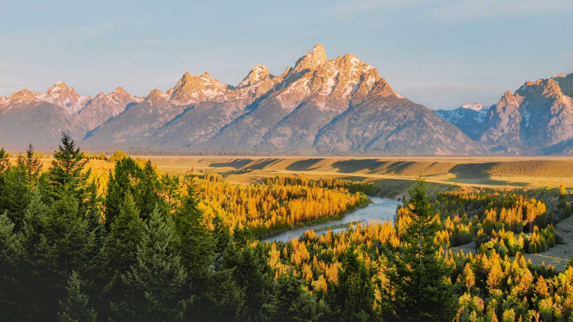 View from Snake River Overlook over the river and Teton Range's mountains in the background.