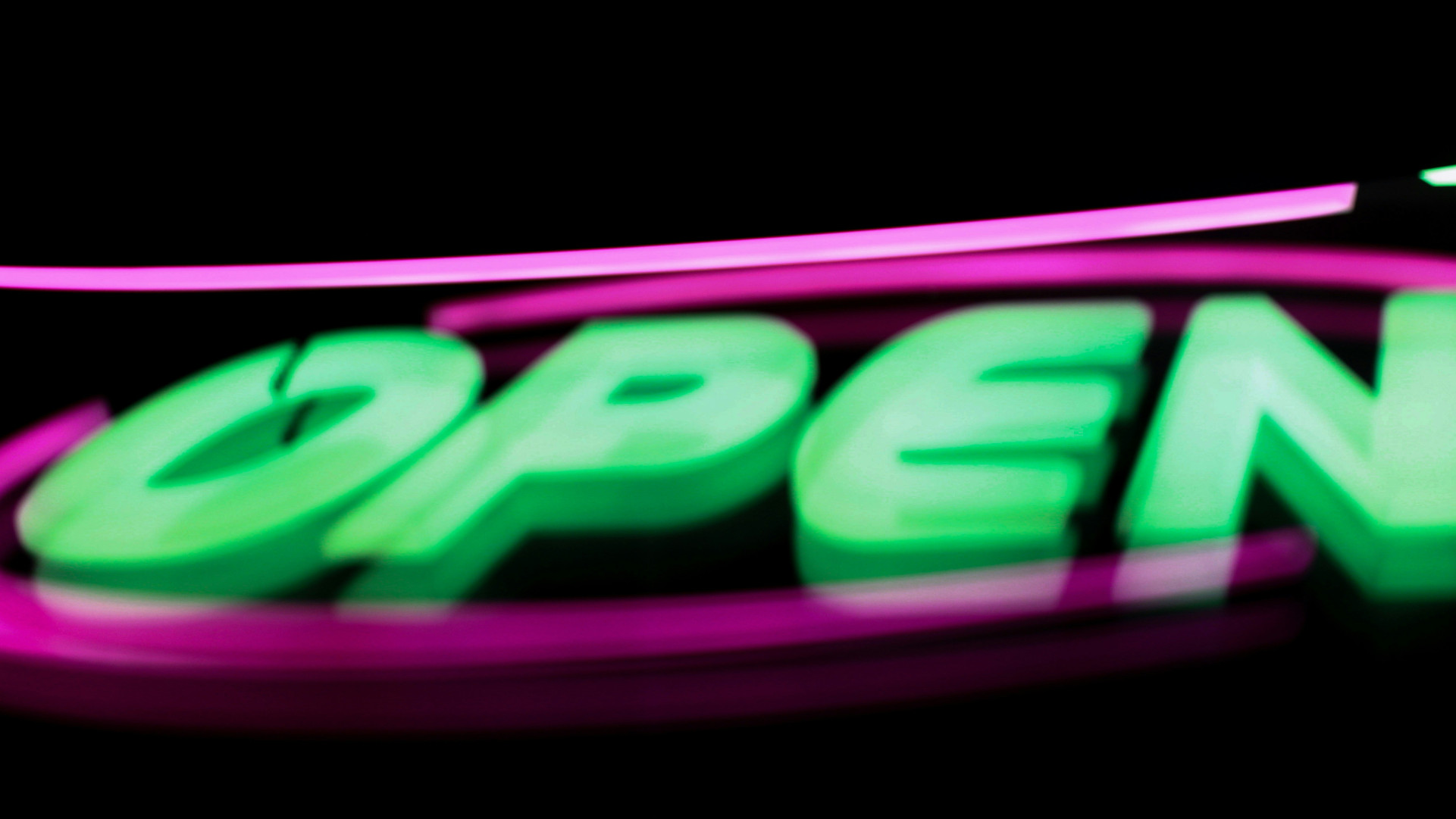 A neon sign that says open