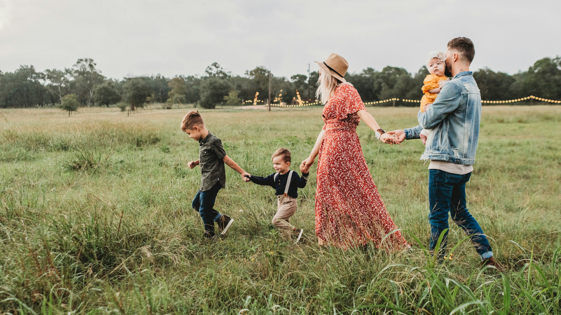 Family walking through a field