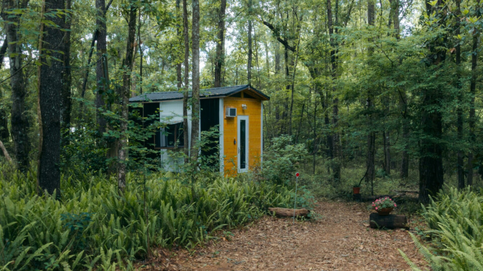 A tiny house in a wooded area