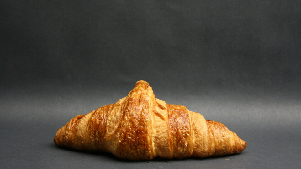 Croissant sitting on a gray surface