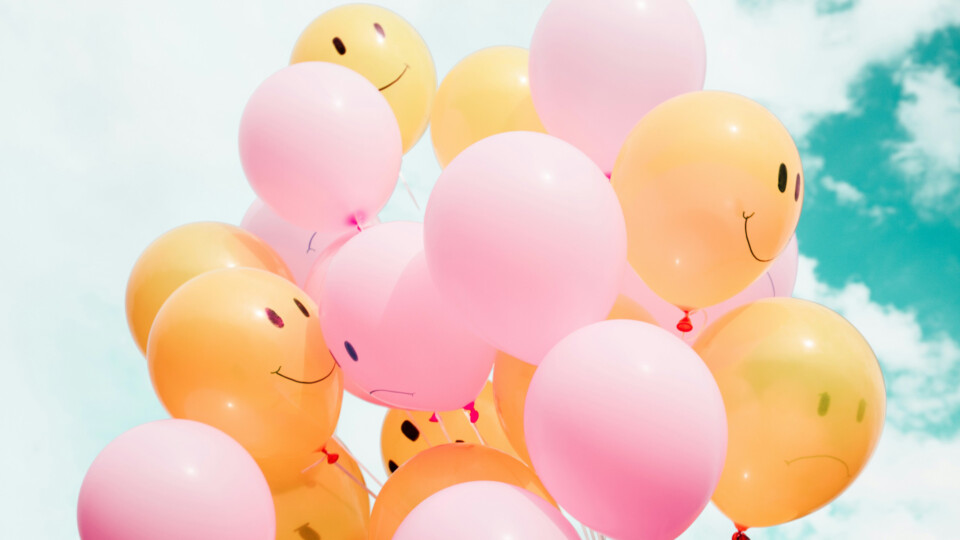 Balloons with happy faces on them