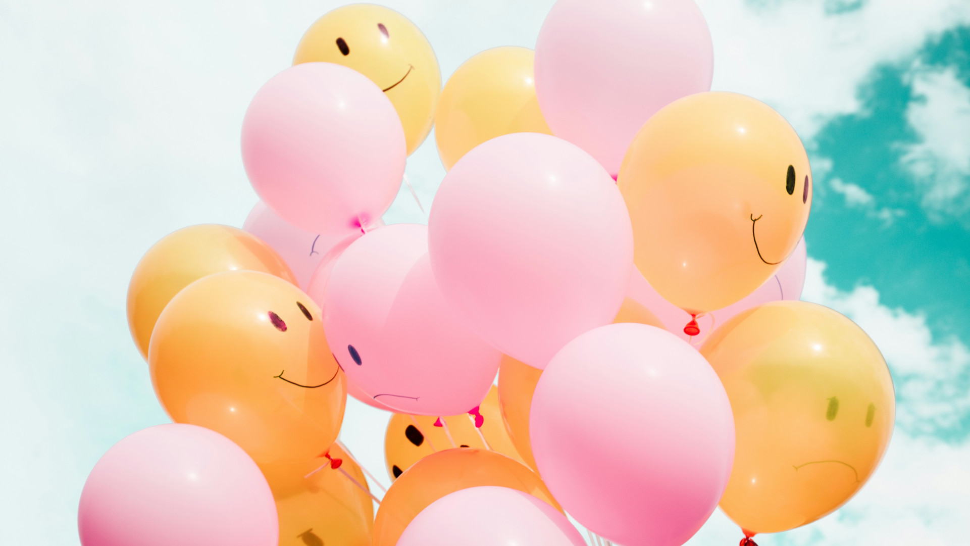 Balloons with happy faces on them