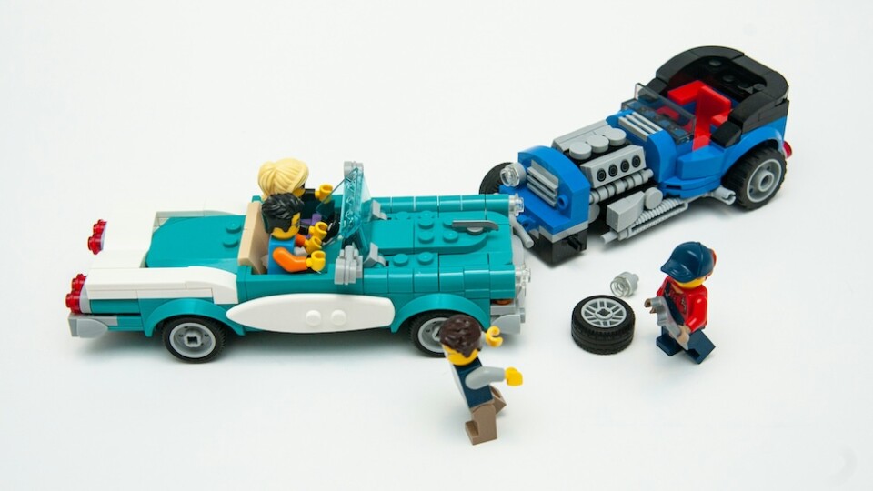A posed scene showing two lego cars which appear to have been involved in an accident