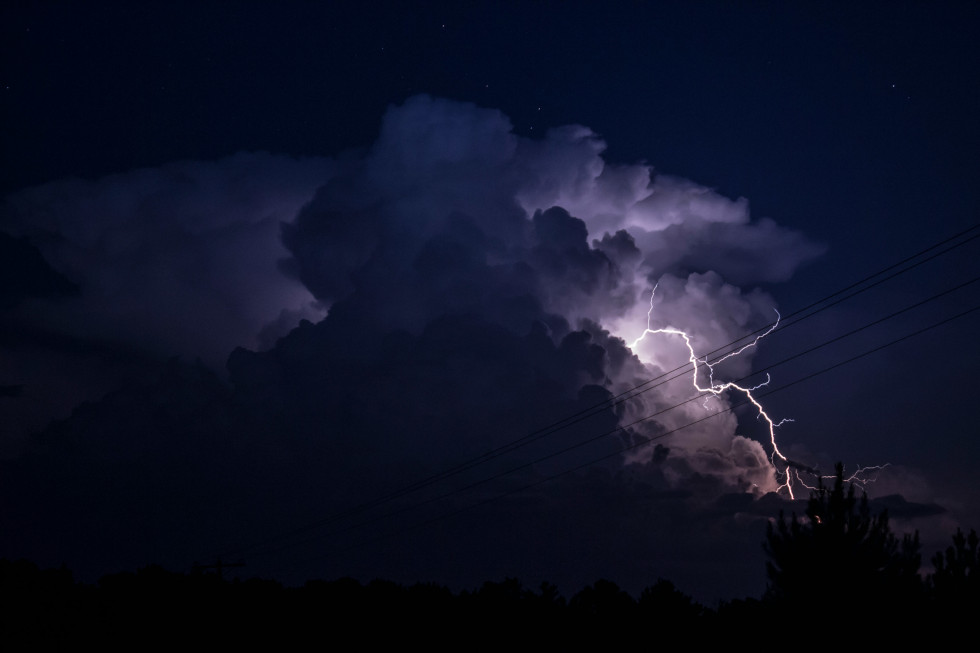 Lighting on dark purple skies