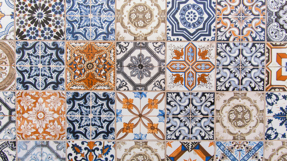 Multi-colored tiles with intricate patterns on a wall