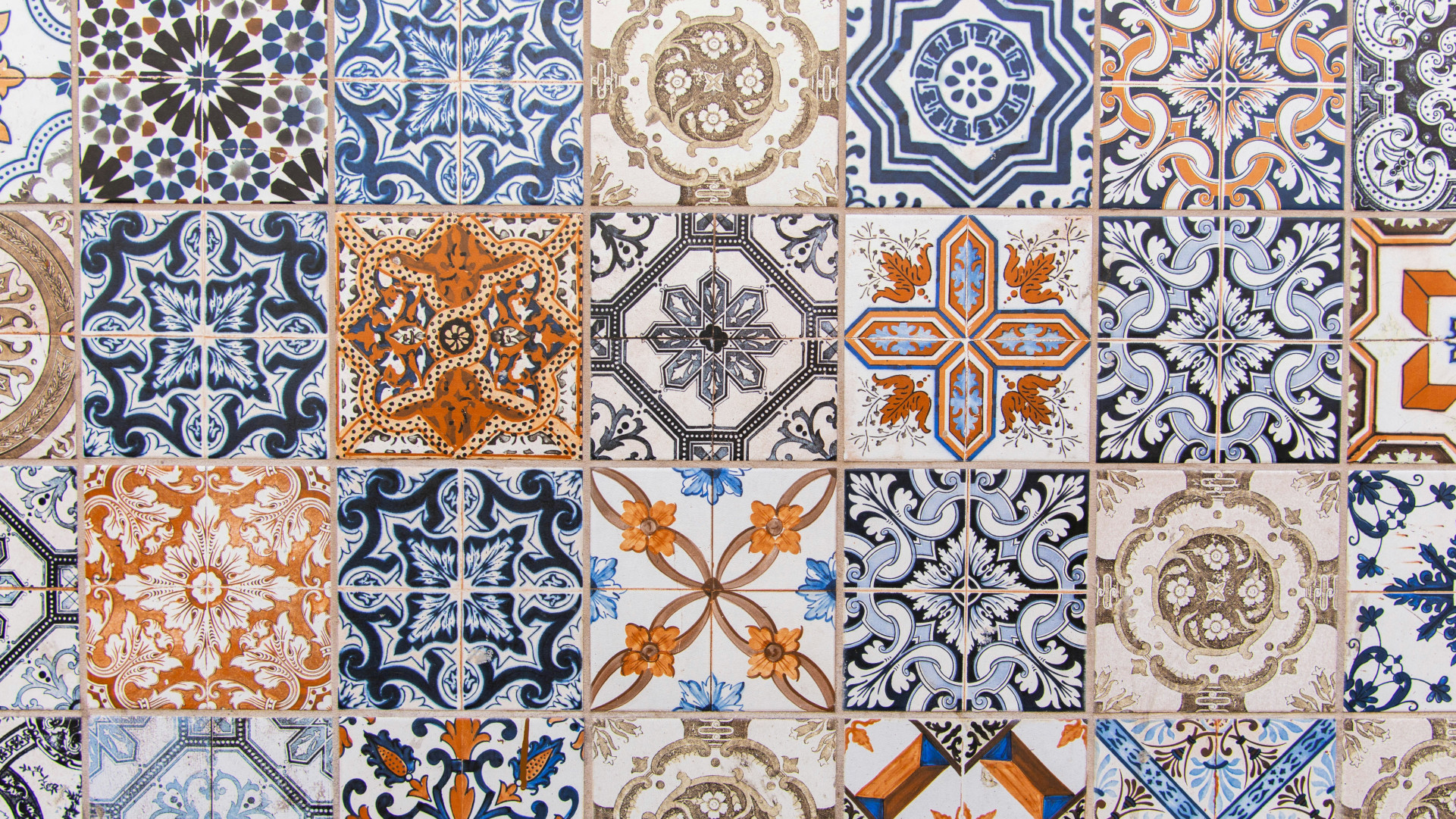 Multi-colored tiles with intricate patterns on a wall