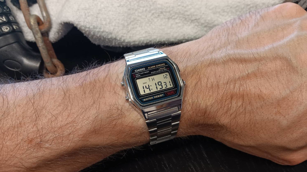 Man's arm wearing a Casio digital watch