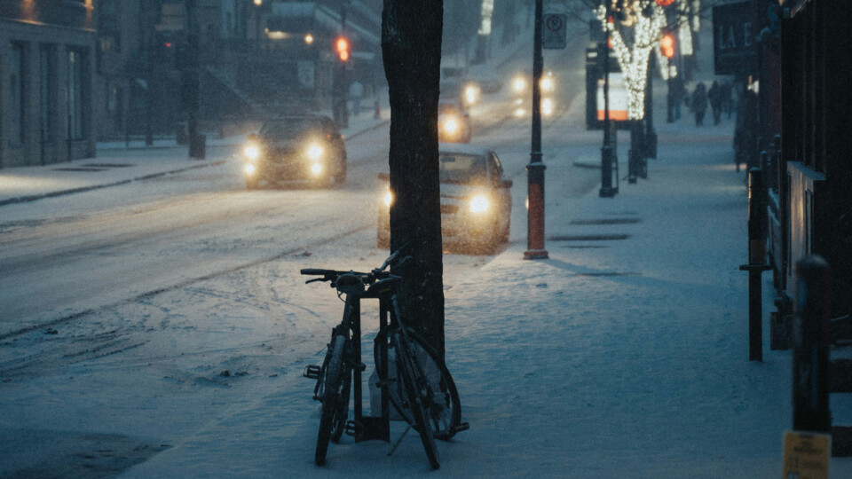 A dark snowy, city street.