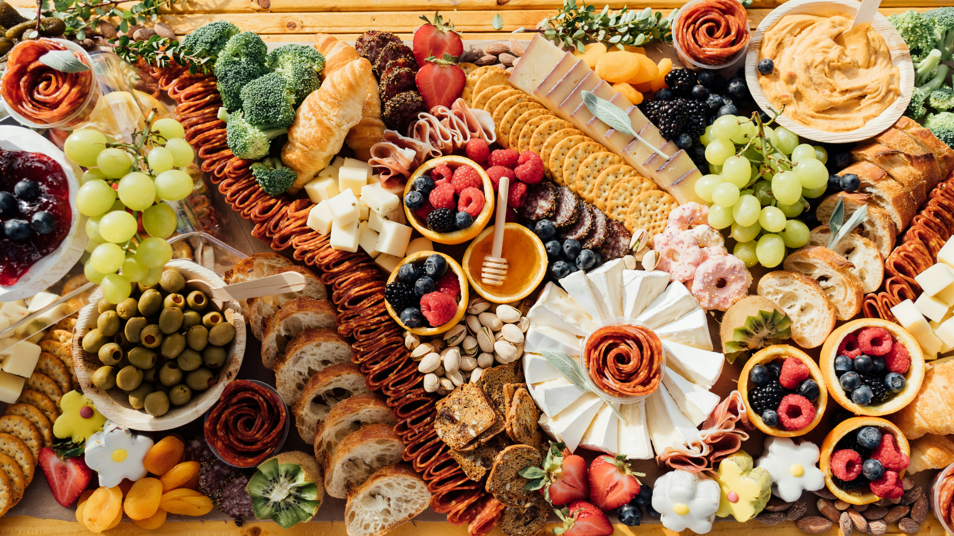 A wooden table topped with lots of different types of food photo.